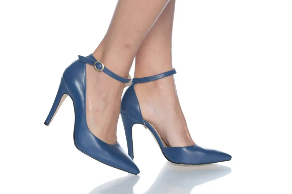Handmade navy heels worn, shot on a white background