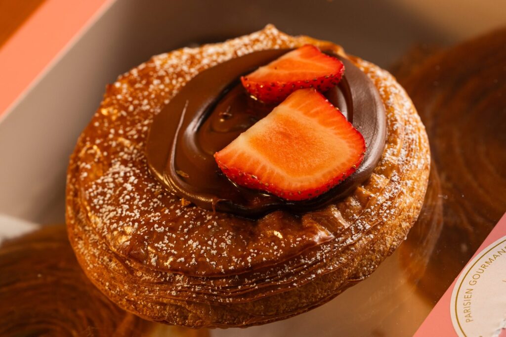 Macro product photo of a chocolate and strawberry danish