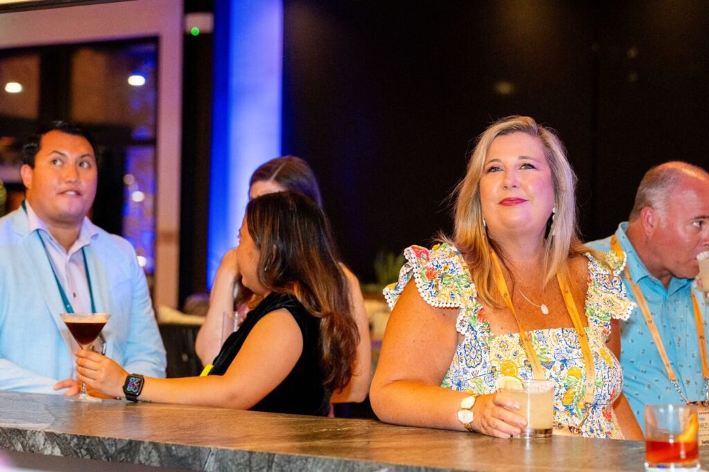 Guests talking at the bar during the Marzul grand opening