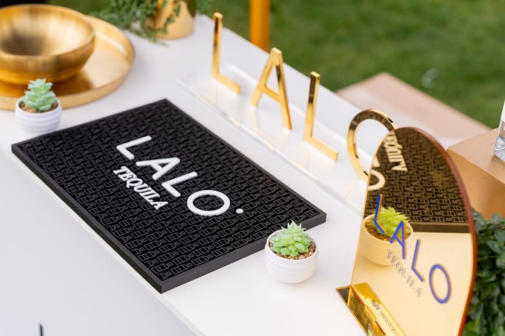 A branded tequila tray on a table, a detail shot from the Marzul grand opening