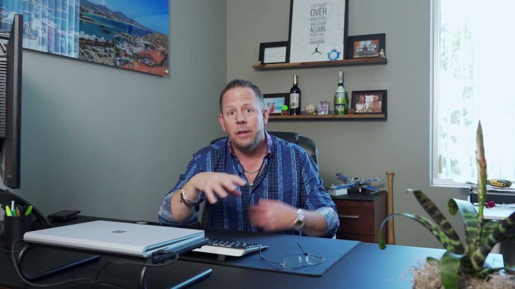Drew of Del Toro Loans talking to the camera in his video review