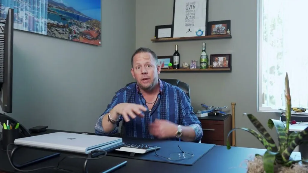 Drew of Del Toro Loans talking to the camera in his video review