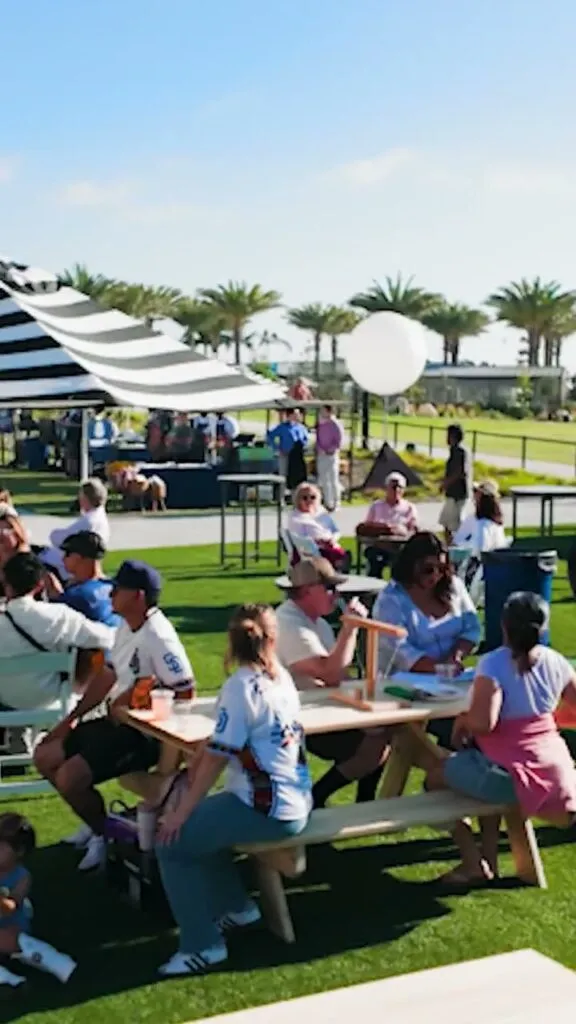 Families at picnic tables on the lawn during the 4th Sunday event at the Gaylord Pacific